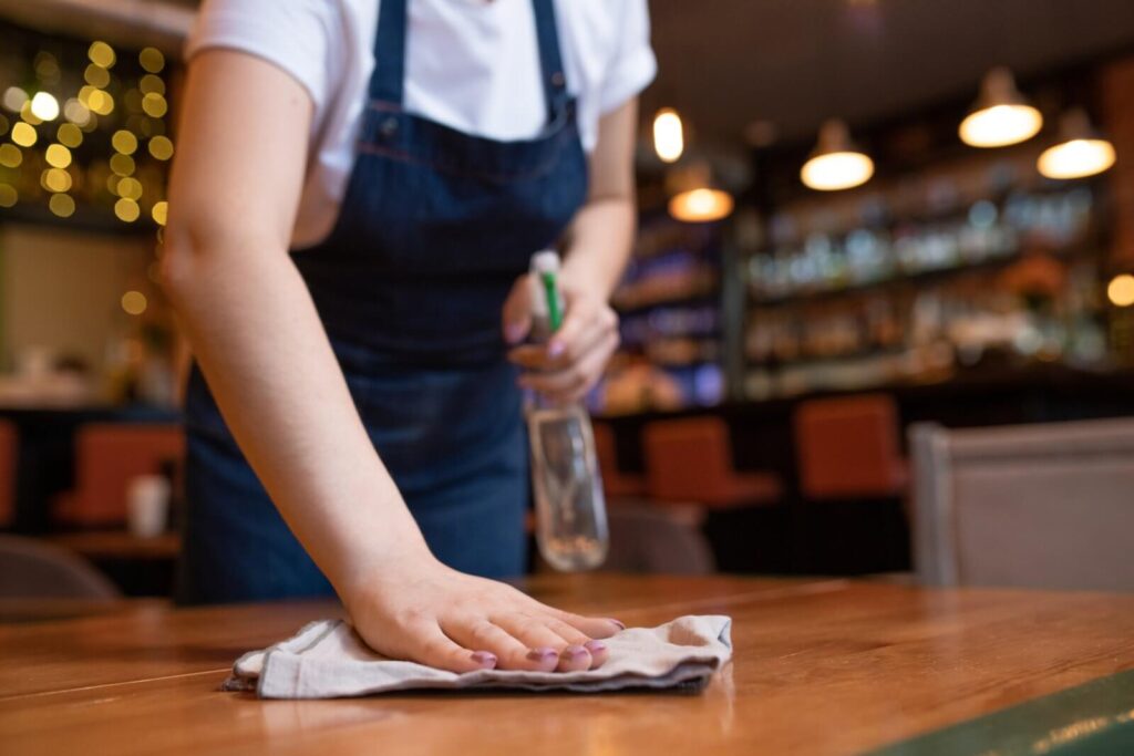 Professional cleaners in a commercial restaurant dining room